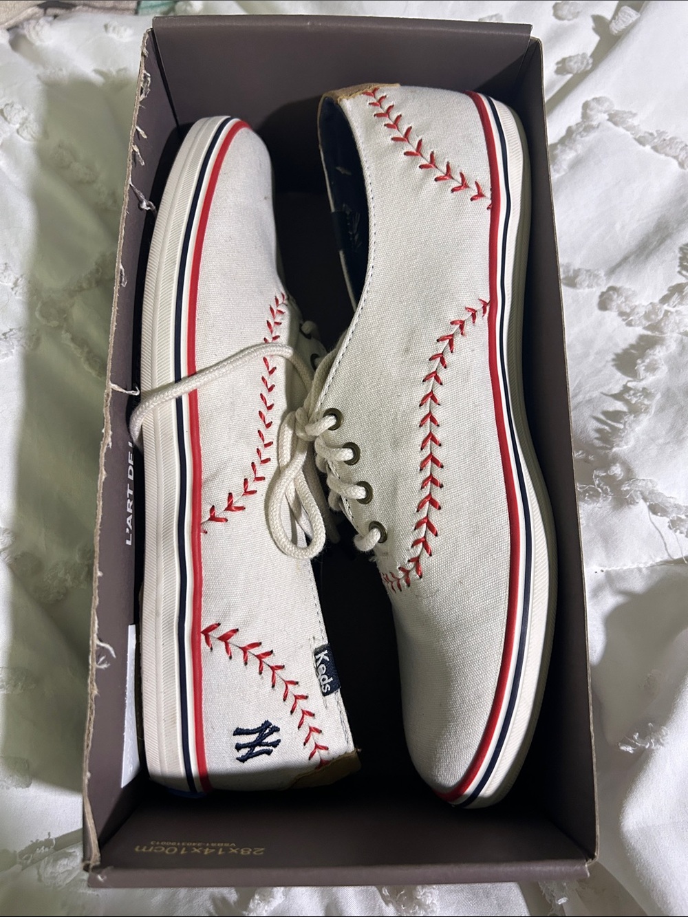 Keds White Canvas Sneakers with Red Baseball Stitch Detail